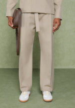 relaxed-fit-textured-belted-tailored-trousers-beige