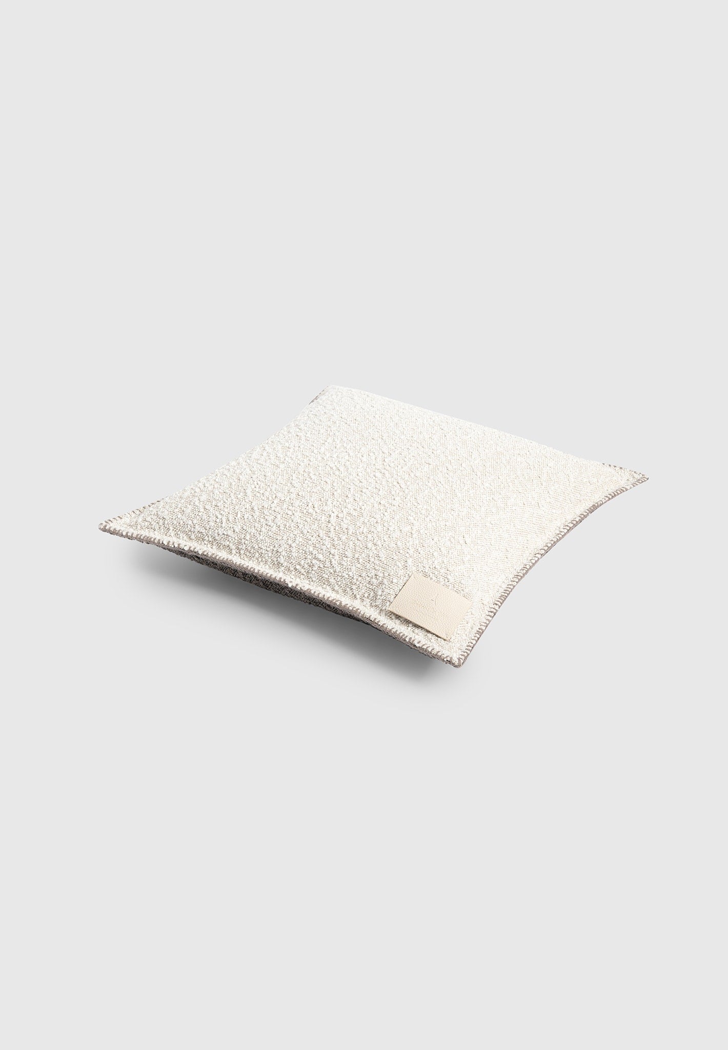 boucle-and-whipstitch-reversible-cushion-brown-cream