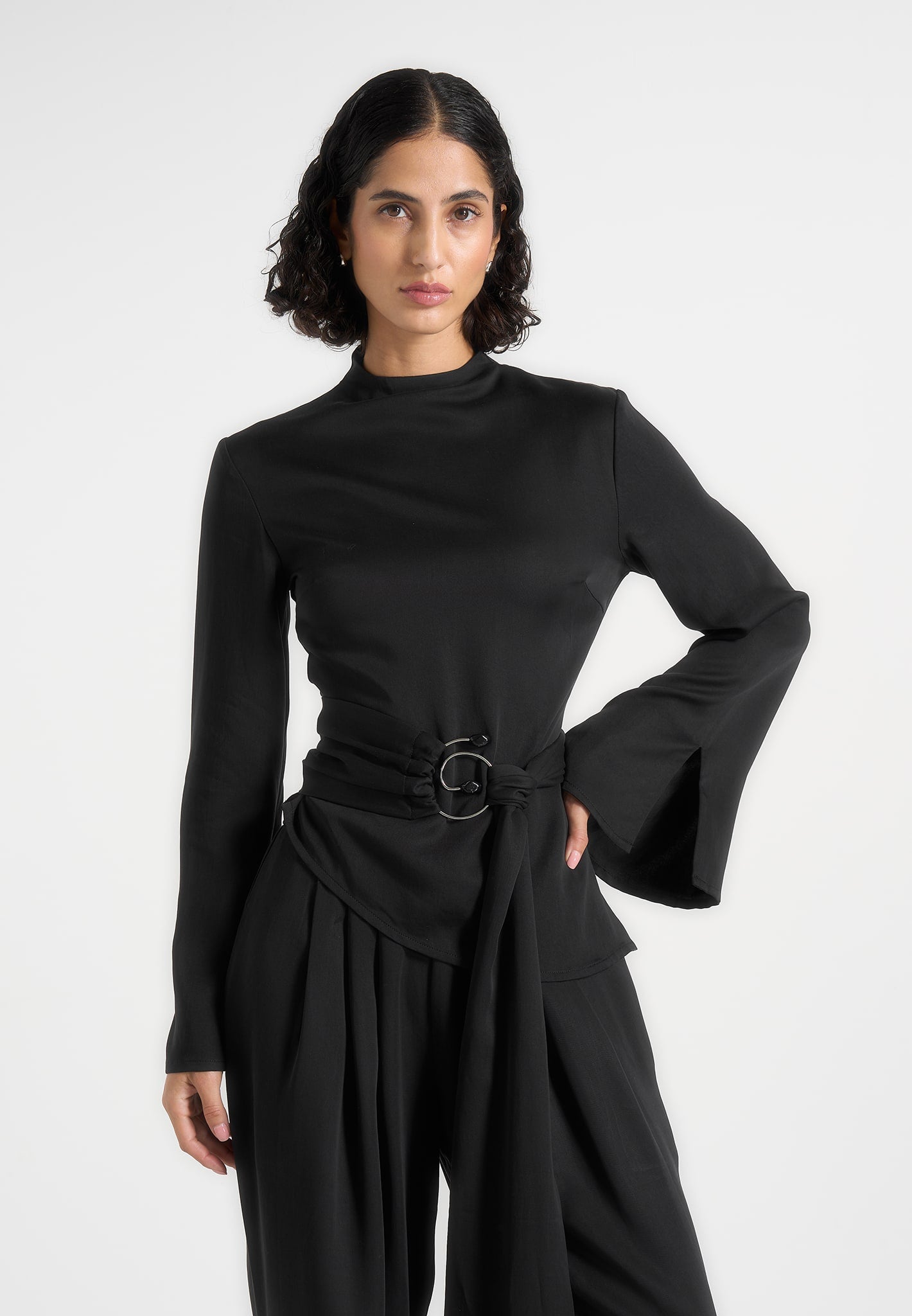 aurore-mock-neck-ring-belt-pleated-leg-jumpsuit-black