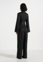 aurore-mock-neck-ring-belt-pleated-leg-jumpsuit-black