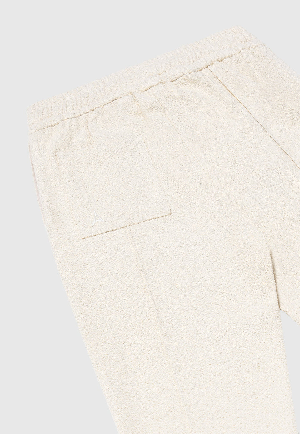 boucle-pintuck-tapered-trousers-beige